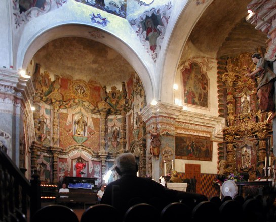 San Xavier del Bac interior man sitting